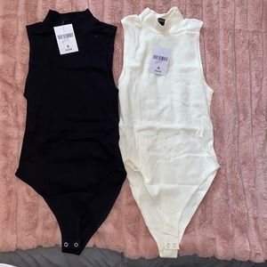One white and one back sleeveless body suits